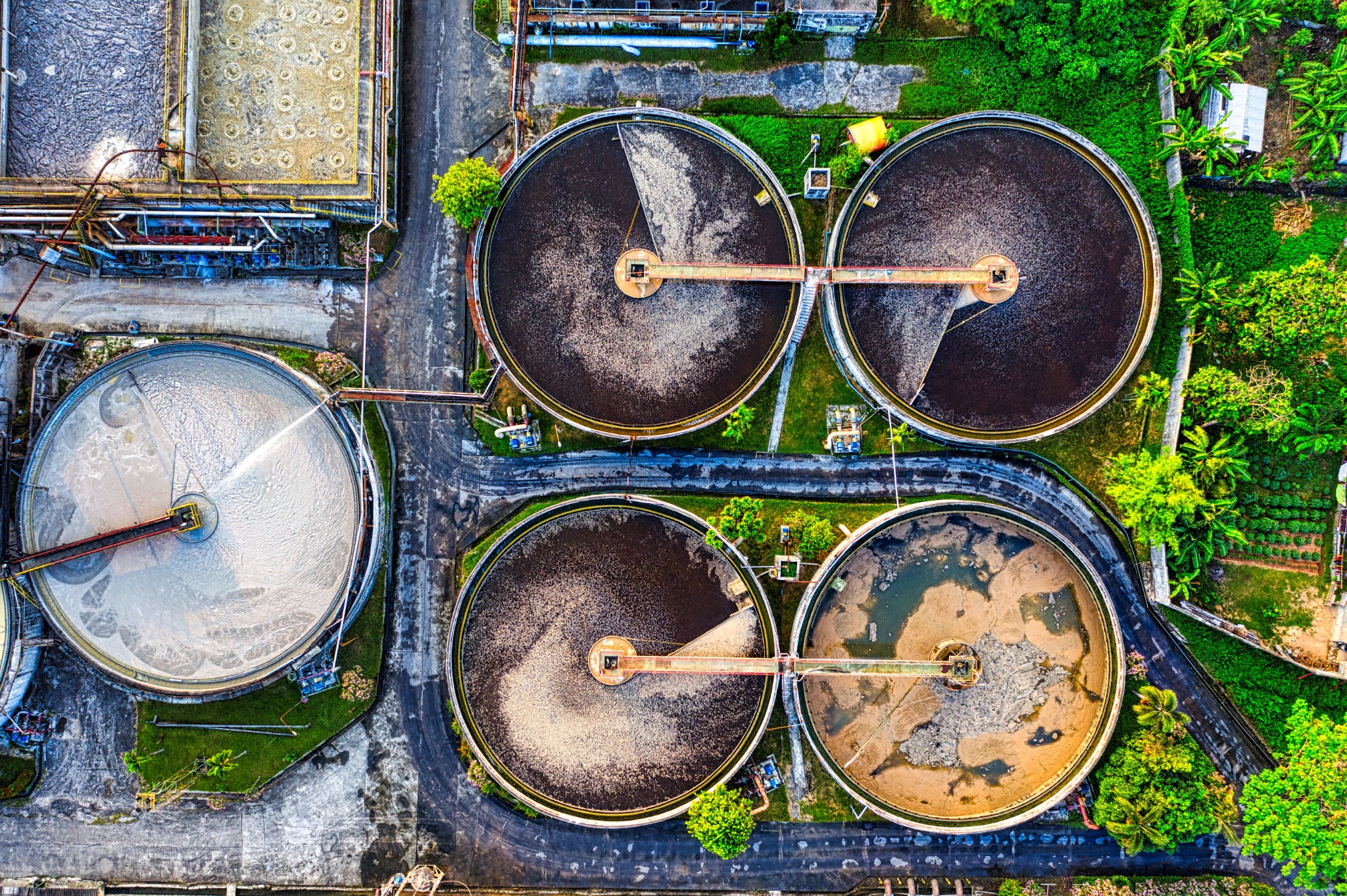 Aerial view of wastewater treatment basins representing biochar heavy metal and wastewater remediation